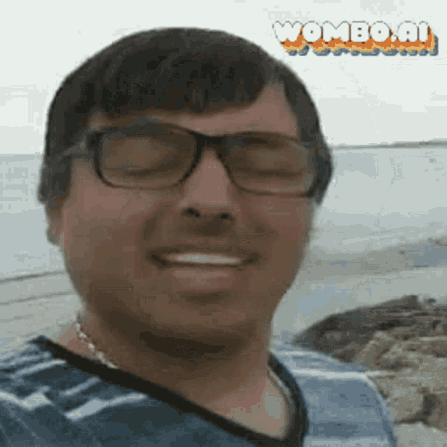 a man wearing glasses is smiling for the camera .