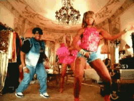 a group of people are dancing in a room