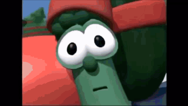 a close up of a cartoon character with big eyes wearing a headband .