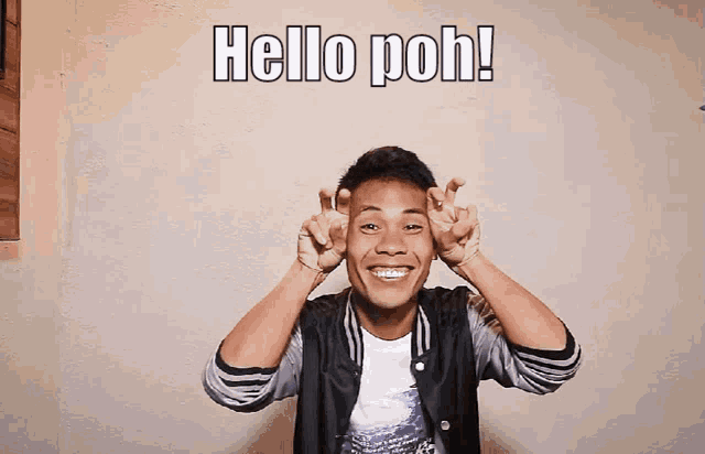 a man making a peace sign with the words hello poh written above him