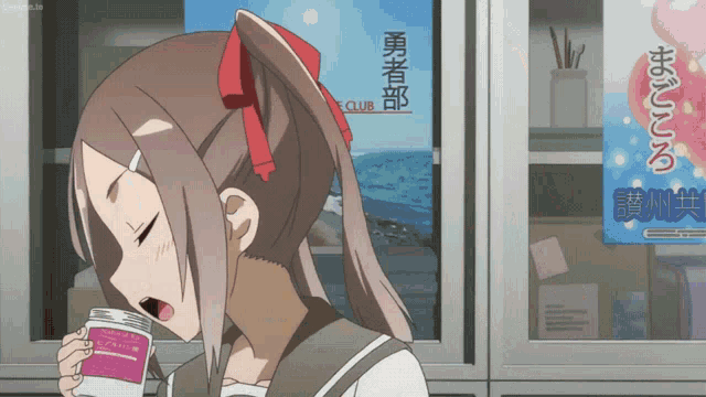 a girl in a ponytail drinking from a bottle in front of a sign that says fc club