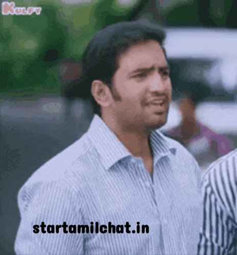 a man in a striped shirt is making a funny face with the website starttamilchat.in written below him