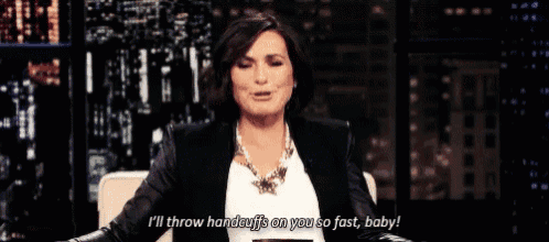 a woman is sitting on a couch and saying " i 'll throw handcuffs on you so fast baby "