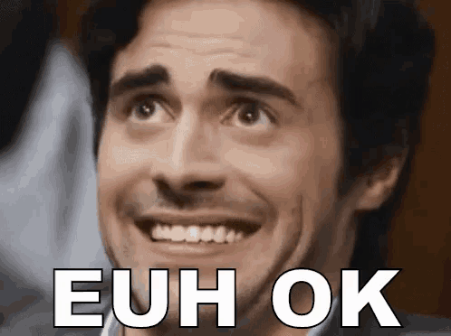 a close up of a man 's face with the words euh ok written above him