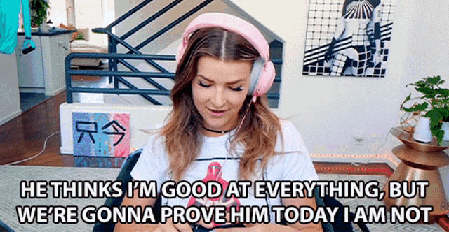 a woman wearing pink headphones says he thinks i 'm good at everything