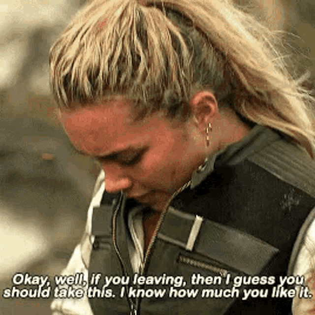 a woman is crying and talking to another woman while wearing a vest .