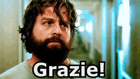 a man with a beard says grazie on the screen