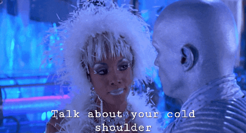 a man and a woman are kissing with the words talk about your cold shoulder on the bottom