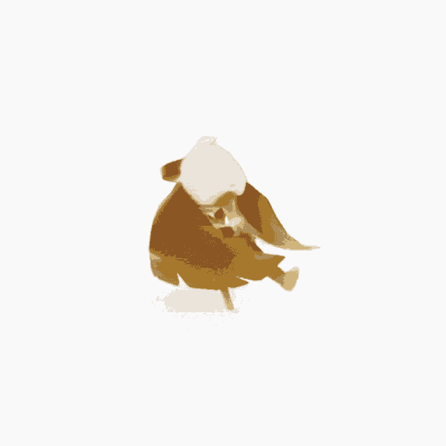 a yellow object with a white feather on top