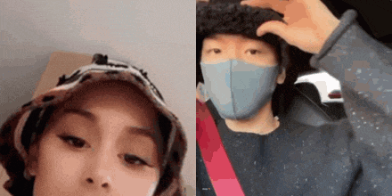 a man and a woman wearing face masks and hats are standing next to each other .