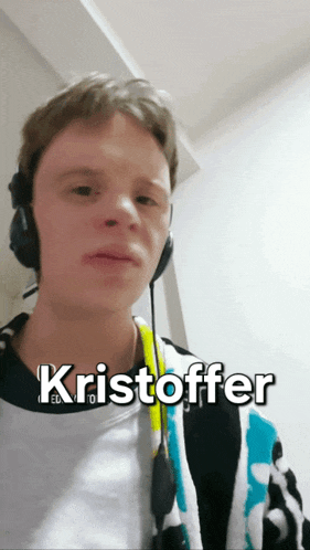 a young man wearing headphones with the name kristoffer written on the bottom
