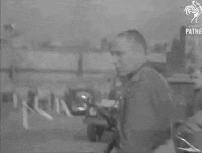 a black and white photo of a military truck with a white star on the back