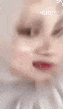 a woman wearing a white hijab with the words rindu tak written on it