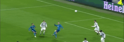 a group of soccer players are playing a game of soccer on a soccer field .