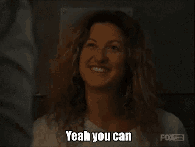 a woman in a white shirt is smiling and says " yeah you can "
