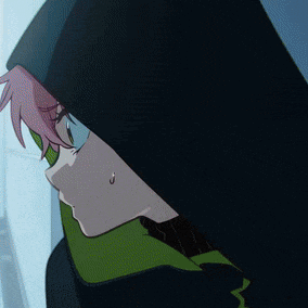 a close up of a person wearing a hood and a green scarf .