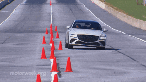 a car is driving down a road with motorweek.org written on the bottom right