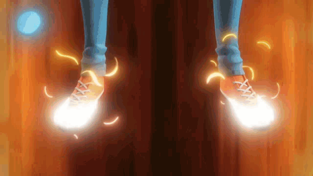 a person is standing on a wooden floor with glowing shoes .