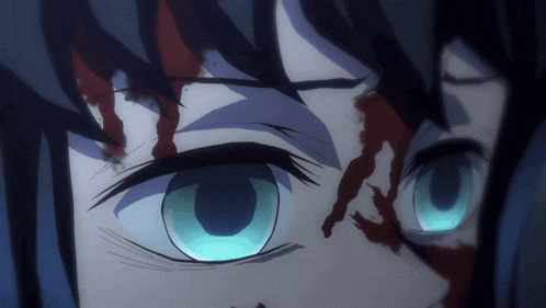 a close up of a person 's blue eyes with blood on them