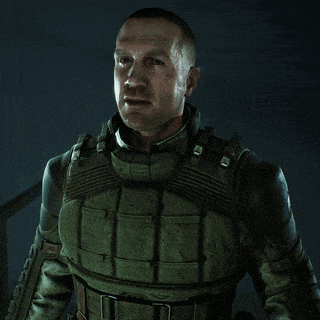 a man in a military uniform is smiling and looking at the camera