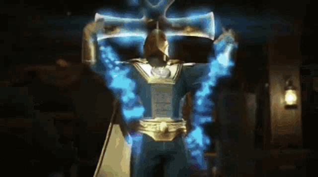 a man in a superhero costume with his arms outstretched is surrounded by blue light .