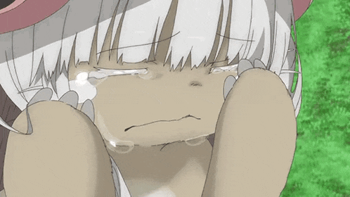 a girl with white hair is crying with her eyes closed .