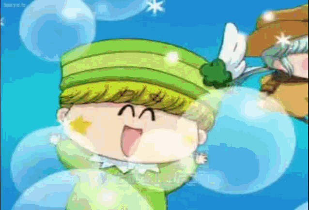 a cartoon character is wearing a green hat with wings on it