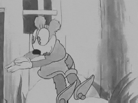a black and white cartoon of a cartoon character in a cowboy outfit .