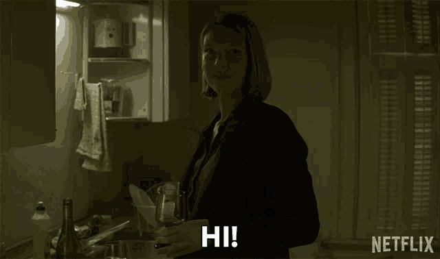 a woman in a kitchen with a netflix logo on the bottom