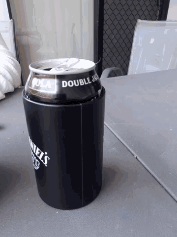 a can of jack daniel 's sits in a black container