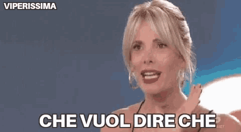 a woman is making a funny face and saying che vuol dire che in italian .