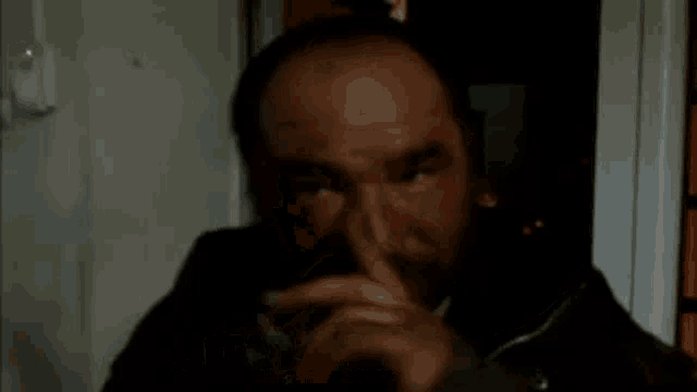 a man is pointing at the camera with the words nu te uita la mine banghiu below him