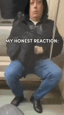 a man in a hooded jacket is sitting on a train with the words my honest reaction written above him