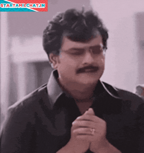 a man with glasses and a mustache is praying with a starttamilchat.in logo in the background