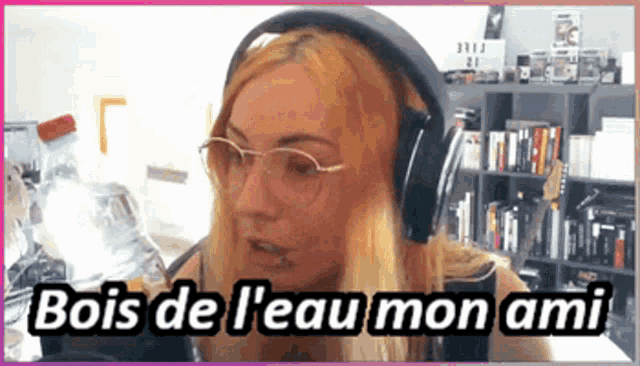 a woman wearing headphones and glasses says bois de l' eau mon ami