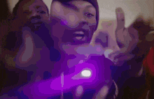a group of men are standing next to each other and giving a thumbs up sign .