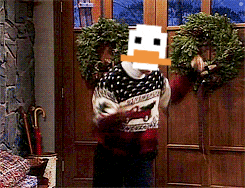 a man wearing a sweater with a duck on his face