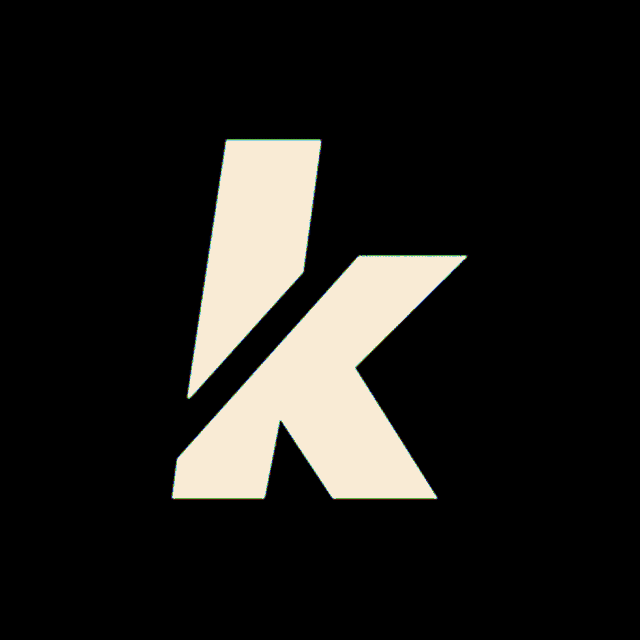 a white letter k with red and green stripes
