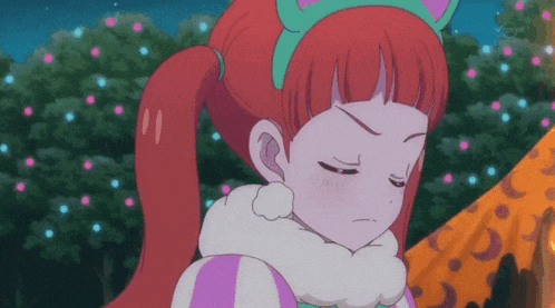 a cartoon girl with red hair and a cat headband