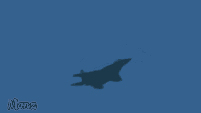 a silhouette of a fighter jet flying through a blue sky with the word monz on the bottom