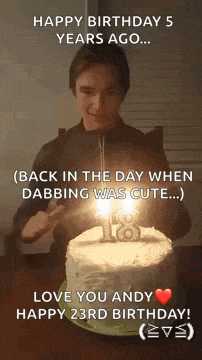 a man is blowing out a candle on a cake .