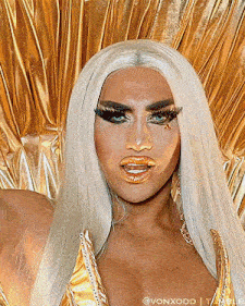 a close up of a drag queen 's face with the name vonxodd on the bottom right