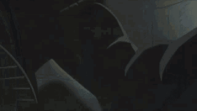 two cars are driving through a tunnel with their headlights on .