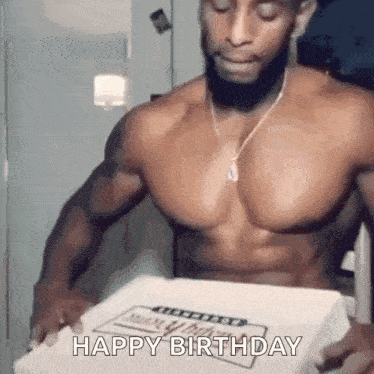 a shirtless man is holding a pizza box with a birthday cake in it .