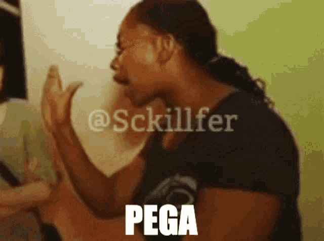 a woman in a black shirt with the word pega written on her face