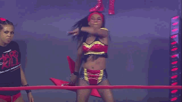 a woman in a wrestling ring is wearing a black shirt that says ioi