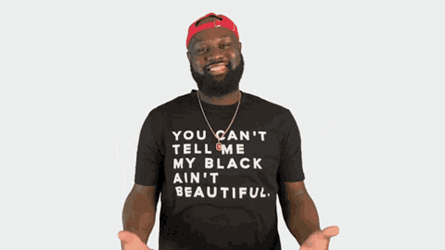 a man wearing a black t-shirt that says you can 't tell me my black ain 't beautiful