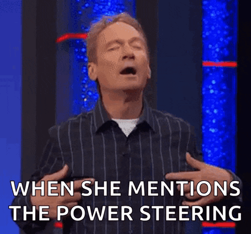 a man in a striped shirt says when she mentions the power steering .