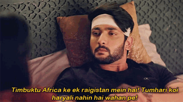 a man with a bandage on his head is laying in bed with a caption that says timbuktu africa