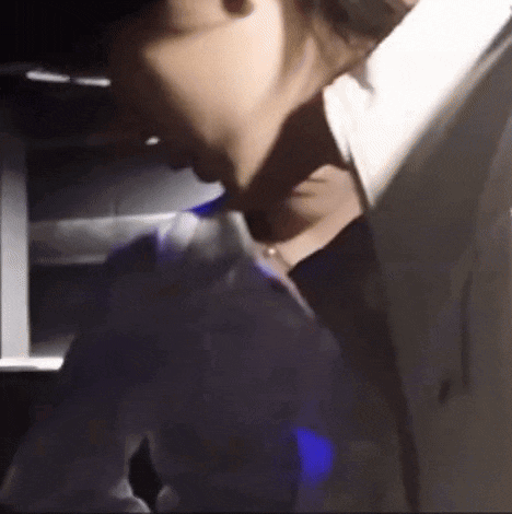 a close up of a person 's neck with a blue light behind them .